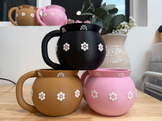 Jarrito ice cream pint holders in brown, pink, and black with white floral details