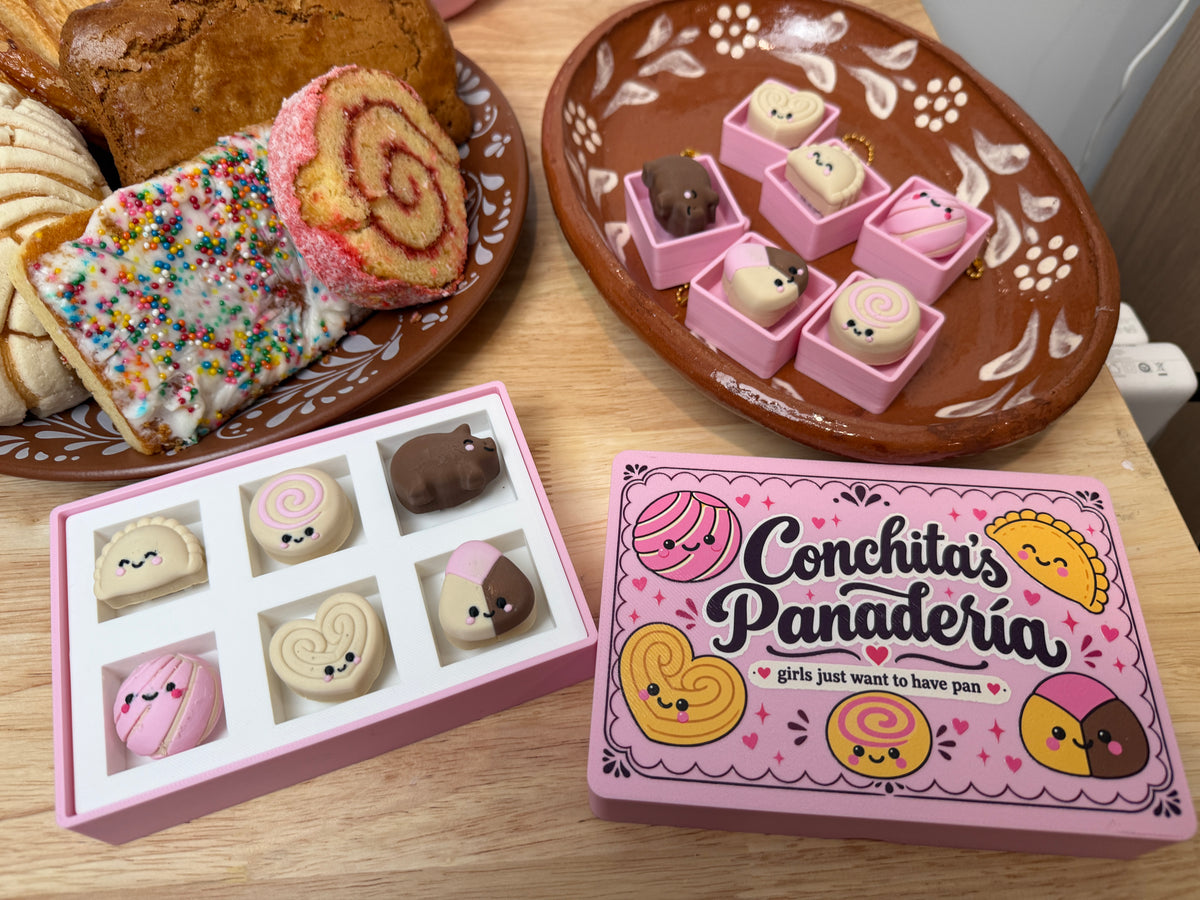 Complete pan dulce clicker collection with Conchita's Panaderia illustrated pink bakery box lid